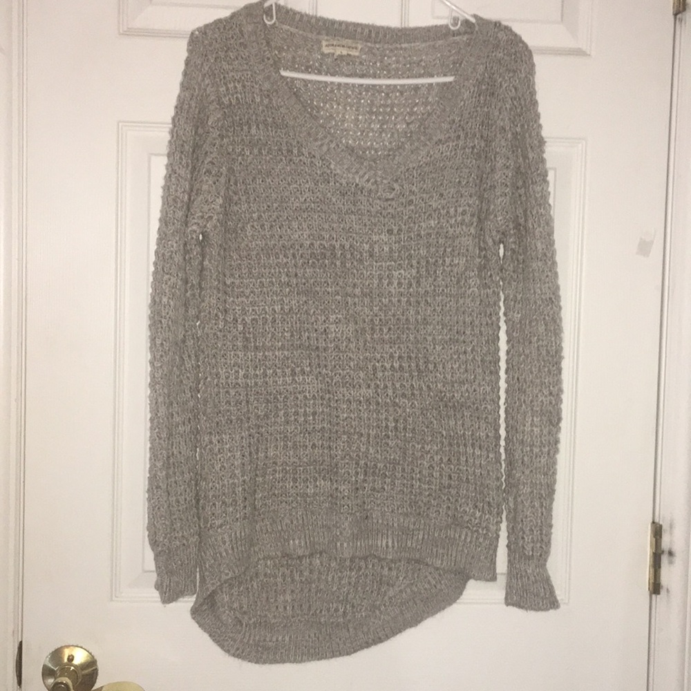 Light gray V-neck sweater